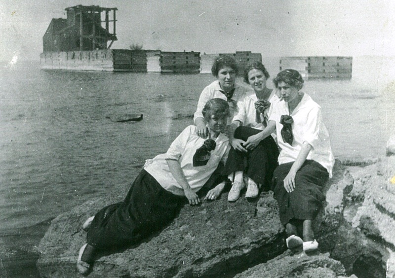 Unidentified Women Sitting on a Rock