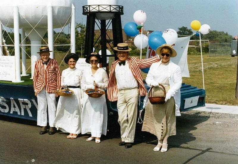 Louis McDermott with Unidentified Group in Front of Horton Steel Float, #1