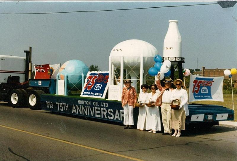 Louis McDermott with Unidentified Group in Front of Horton Steel Float, #2